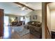 Cozy living room featuring hardwood floors, high ceilings, and sliding glass doors to a porch at 421 Kingsway Ct, Mooresville, IN 46158