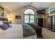 Comfortable main bedroom with vaulted ceiling, mounted TV, and ample natural light at 421 Kingsway Ct, Mooresville, IN 46158
