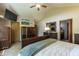 Bright main bedroom featuring a bed with a decorative headboard and TV at 421 Kingsway Ct, Mooresville, IN 46158