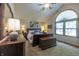 Spacious main bedroom featuring a vaulted ceiling, arched window, and cozy carpeting at 421 Kingsway Ct, Mooresville, IN 46158