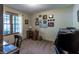 Well-lit office featuring neutral walls, decorative art, and a comfortable wooden desk at 421 Kingsway Ct, Mooresville, IN 46158