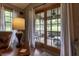 View from inside of sliding glass doors, which lead to a screened in porch with furniture at 421 Kingsway Ct, Mooresville, IN 46158