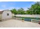 Backyard with a swimming pool and a wooden deck at 4697 W Ridge Dr, Columbus, IN 47203
