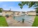 This backyard features a covered pool, shed, and lovely landscaping perfect for outdoor enjoyment and entertainment at 4697 W Ridge Dr, Columbus, IN 47203