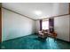 Cozy bedroom offers comfort and relaxation, enhanced by ample natural light at 4697 W Ridge Dr, Columbus, IN 47203