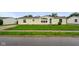 Inviting single-story house with a neat front lawn and tidy landscaping at 4697 W Ridge Dr, Columbus, IN 47203