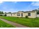 Pleasant single-story home features a green lawn and simple, clean lines for a welcoming look at 4697 W Ridge Dr, Columbus, IN 47203