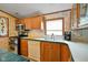 Traditional kitchen featuring oak cabinets, stainless steel appliances and neutral countertops at 4697 W Ridge Dr, Columbus, IN 47203