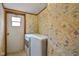 View of the laundry room with washer, dryer, and exterior door at 4697 W Ridge Dr, Columbus, IN 47203
