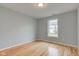 Bright bedroom featuring wood floors, light blue walls, and a window for natural light at 524 S Meridian S St, Lebanon, IN 46052