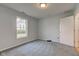 A bedroom with light-blue walls, blue carpets, and one closet at 524 S Meridian S St, Lebanon, IN 46052