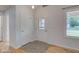 Bright entryway featuring hardwood floors, a decorative front door, and ample natural light at 524 S Meridian S St, Lebanon, IN 46052