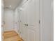 Bright hallway featuring multiple white doors and hardwood floors at 524 S Meridian S St, Lebanon, IN 46052