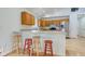 Open kitchen featuring a breakfast bar, stainless steel appliances, and ample cabinet space at 524 S Meridian S St, Lebanon, IN 46052