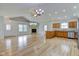 An open living room with hardwood floors, a fireplace, and a kitchen at 524 S Meridian S St, Lebanon, IN 46052