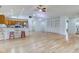 Spacious living room boasts wood floors, built-in shelving, and a ceiling fan for optimal comfort at 524 S Meridian S St, Lebanon, IN 46052