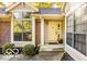 Close-up of the front entryway highlighting the large windows and brick accents at 5303 Windridge Dr # 172, Indianapolis, IN 46226