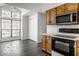 Bright kitchen featuring modern appliances, ample cabinet space, and a large window for natural light at 5303 Windridge Dr # 172, Indianapolis, IN 46226