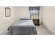 Cozy bedroom features carpet, a single window with blue curtains, plus a dresser and bedside table at 545 Pitney Dr, Noblesville, IN 46062