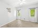 A bright bedroom with neutral carpet, white walls, two windows, and a ceiling fan at 545 Pitney Dr, Noblesville, IN 46062