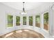 Breakfast nook with large windows offering beautiful views of the surrounding greenery at 545 Pitney Dr, Noblesville, IN 46062