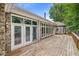 Back exterior view of a brick home, showcasing a wooden deck and multiple window views at 545 Pitney Dr, Noblesville, IN 46062