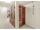 Basement hallway features a built-in cedar sauna with glass paneled doors, carpet flooring and neutral walls at 545 Pitney Dr, Noblesville, IN 46062
