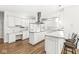 Bright kitchen with stainless steel appliances, marble countertops, and a functional island with seating at 545 Pitney Dr, Noblesville, IN 46062
