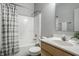 Bathroom features a shower and tub combo and vanity with ample storage at 5883 Hollow Oak, Carmel, IN 46033