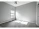 Bedroom offers neutral carpet, ample light, and single window at 5883 Hollow Oak, Carmel, IN 46033