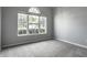 Bedroom with neutral carpet, large window with backyard view, and ample light at 5883 Hollow Oak, Carmel, IN 46033