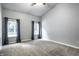 Spacious bedroom features vaulted ceilings, large windows, and neutral carpet at 5883 Hollow Oak, Carmel, IN 46033
