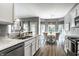 Eat-in kitchen features granite countertops, stainless steel appliances, and natural light at 5883 Hollow Oak, Carmel, IN 46033