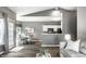 Spacious living area connecting the kitchen and dining room, featuring modern decor at 5883 Hollow Oak, Carmel, IN 46033