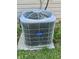 Outdoor Carrier air conditioning unit on concrete slab surrounded by grass at 6027 Crystal View Dr, Indianapolis, IN 46237