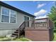 Exterior view of siding, windows, and a raised deck in the backyard of a house at 6027 Crystal View Dr, Indianapolis, IN 46237