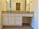 A bathroom with a sink and vanity with neutral stone countertops and a framed mirror at 6027 Crystal View Dr, Indianapolis, IN 46237