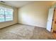 Bright bedroom with a large window and neutral walls and carpet at 6027 Crystal View Dr, Indianapolis, IN 46237