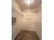 A walk-in closet featuring built-in shelving and carpet flooring at 6027 Crystal View Dr, Indianapolis, IN 46237