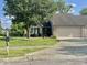 Charming single-story home with a well-maintained lawn and a two-car attached garage at 6027 Crystal View Dr, Indianapolis, IN 46237