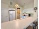 Bright kitchen with white cabinetry, stainless appliances, and a breakfast bar area at 6027 Crystal View Dr, Indianapolis, IN 46237