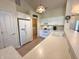 Well-lit kitchen featuring white cabinets, stainless appliances, and tile floors at 6027 Crystal View Dr, Indianapolis, IN 46237