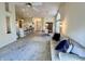 Bright living room features plush sofa, open floor plan, and seamless flow into the kitchen and dining areas at 6027 Crystal View Dr, Indianapolis, IN 46237