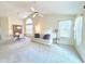 Bright living space featuring a sofa and dining area with large windows for natural light at 6027 Crystal View Dr, Indianapolis, IN 46237