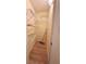 A pantry featuring shelving for organized storage and maintenance cleaning supplies on wood floors at 6027 Crystal View Dr, Indianapolis, IN 46237