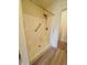 The shower with a built-in seat and a hand-held shower head at 6027 Crystal View Dr, Indianapolis, IN 46237