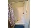 Standard walk-in shower with white surround and a colorful, decorative shower curtain at 6027 Crystal View Dr, Indianapolis, IN 46237