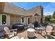 Backyard patio features a hot tub, fireplace, seating and a brick surround at 648 Shakespeare Dr, Avon, IN 46123