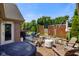 Backyard patio with a hot tub, fireplace, outdoor seating and privacy screens at 648 Shakespeare Dr, Avon, IN 46123