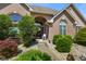 Inviting front entry with an arched doorway, decorative plants, and a welcoming porch at 648 Shakespeare Dr, Avon, IN 46123